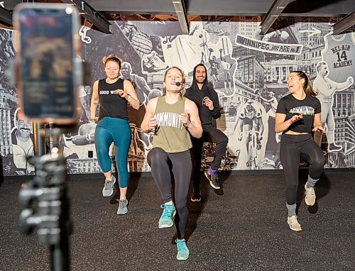 JESSE BOILY / WINNIPEG FREE PRESS
Kelly Sommerfield, left, Amie Seier, Alex Athayde, and Olivia Lee of Community Gym test their livestream workout in Winnipeg on Tuesday, March 17, 2020. They Hope to livestream one or two workouts a day as people practice social distancing. 
Reporter: Eva Wasney
