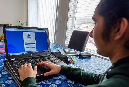 JESSE BOILY / WINNIPEG FREE PRESS
Divya Sharma, a grade 10 Fort Richmond Collegiate student, updates her Edbsy portfolio to inform her teachers of her progress to the online classes at her home on Tuesday, March 17, 2020. The app is available on her phone and her computer. 
Reporter: Maggie Macintosh