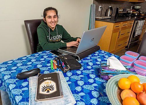 JESSE BOILY / WINNIPEG FREE PRESS
Divya Sharma, a grade 10 Fort Richmond Collegiate student, updates her Edbsy portfolio to inform her teachers of her progress to the online classes at her home on Tuesday, March 17, 2020. The app is available on her phone and her computer. 
Reporter: Maggie Macintosh