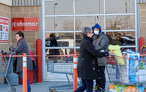 JESSE BOILY / WINNIPEG FREE PRESS
Shoppers line up outside the McGillivray Costco on Wednesday, March 18, 2020 in Winnipeg. 
Reporter: