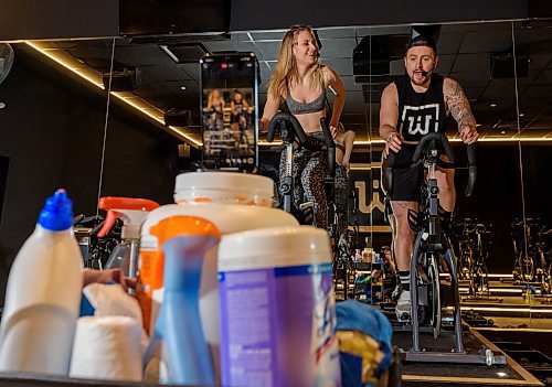 JESSE BOILY / WINNIPEG FREE PRESS
Hannah Pratt, left, and Casey Lanxon-Whitford livestream their spin class at Wheelhouse Cycle Club in Winnipeg on Wednesday, March 18, 2020. In addition to the live-streaming they are also renting out the bike for people to participate at home.
Reporter: Melissa Martin