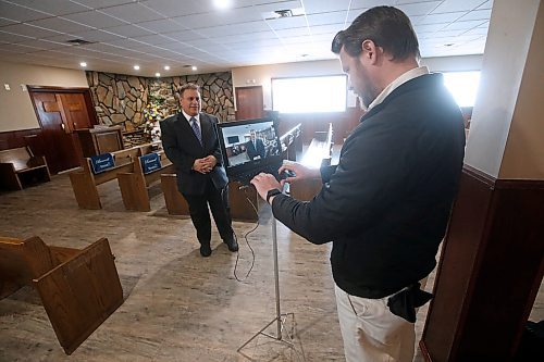JOHN WOODS / WINNIPEG FREE PRESS
Michael Vogiatzakis, left, general manager of Voyage Funeral Home, and Cole Runnels, funeral director assistant, are setting up live streaming in his funeral home in Winnipeg Wednesday, March 18, 2020. Funeral homes are changing their practices in this time of social isolation.

Reporter: Suderman
