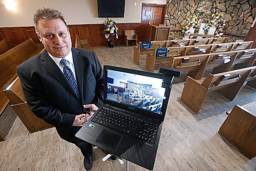 JOHN WOODS / WINNIPEG FREE PRESS
Michael Vogiatzakis, general manager of Voyage Funeral Home, is setting up live streaming in his funeral home in Winnipeg Wednesday, March 18, 2020. Funeral homes are changing their practices in this time of social isolation.

Reporter: Suderman