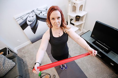JOHN WOODS / WINNIPEG FREE PRESS
Jennifer Karton, who has a nineteen month old toddler, has adapted and changed her gym routine to working out at home in Winnipeg Wednesday, March 18, 2020. 

Reporter: Carnevale