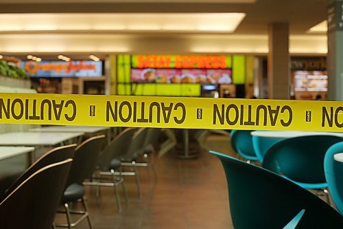 SHANNON VANRAES / WINNIPEG FREE PRESS
Tables and chairs at CF Polo Park's food court are wrapped in caution tape amid concerns of COVID-19 on March 18, 2020. While the mall remains open, most stores are closed.