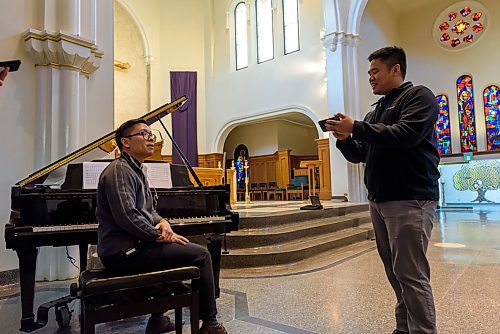 JESSE BOILY / WINNIPEG FREE PRESS
Rev. Geoffrey Angeles, left, and Christian Martinez set up the livestream for their Sunday service amid the COVID-19 outbreak on Thursday, March 19, 2020.
Reporter: Brenda Suderman