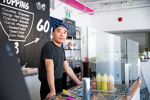 MIKAELA MACKENZIE / WINNIPEG FREE PRESS

Zhehong Wen, who just opened Poke Mono last week, poses for a portrait in his restaurant in downtown Winnipeg on Thursday, March 19, 2020. For Ben Waldman story.
Winnipeg Free Press 2020