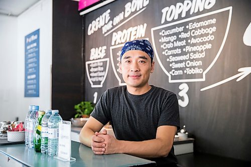 MIKAELA MACKENZIE / WINNIPEG FREE PRESS

Zhehong Wen, who just opened Poke Mono last week, poses for a portrait in his restaurant in downtown Winnipeg on Thursday, March 19, 2020. For Ben Waldman story.
Winnipeg Free Press 2020