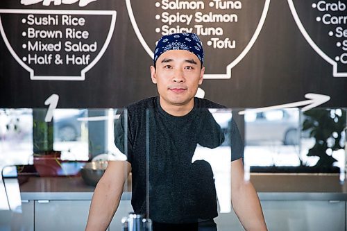 MIKAELA MACKENZIE / WINNIPEG FREE PRESS

Zhehong Wen, who just opened Poke Mono last week, poses for a portrait in his restaurant in downtown Winnipeg on Thursday, March 19, 2020. For Ben Waldman story.
Winnipeg Free Press 2020