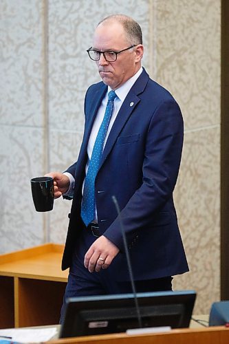 MIKE DEAL / WINNIPEG FREE PRESS
Councillor Scott Gillingham, St. James Ward, returns with a hot beverage during the Winnipeg City Council budget meeting which continued Friday morning.

200320 - Friday, March 20, 2020.