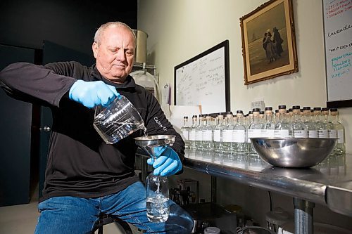 MIKE DEAL / WINNIPEG FREE PRESS
Patent 5 Distillery co-founder, Mike McCallum, pours a bottle of hand sanitizer in their distillery on Alexander Avenue. The gin and vodka distillery had high-proof alcohol laying around, so they started making hand sanitizer. In one day, they made 65 375 ml bottles of sanitizer to donate to organizations. They plan on making close to 200 in the next week.

200320 - Friday, March 20, 2020.