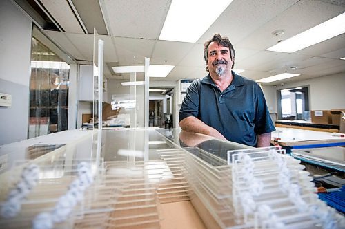 MIKAELA MACKENZIE / WINNIPEG FREE PRESS

John Wardrope, owner of Acryl Design, poses with freshly made cough guards in his shop in Winnipeg on Monday, March 23, 2020. For Malak Abas story.
Winnipeg Free Press 2020