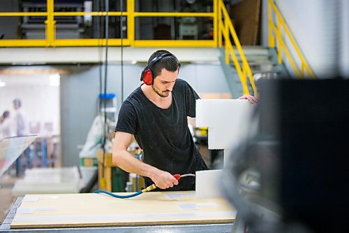 MIKAELA MACKENZIE / WINNIPEG FREE PRESS

Richard Wagner cuts cleans parts for cough guards at Acryl Design in Winnipeg on Monday, March 23, 2020. For Malak Abas story.
Winnipeg Free Press 2020