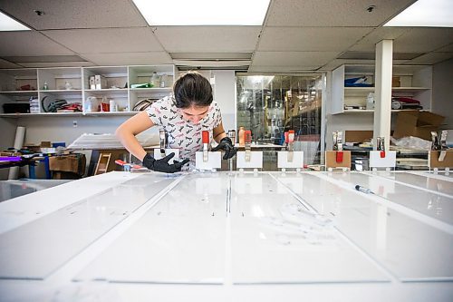 MIKAELA MACKENZIE / WINNIPEG FREE PRESS

Jeanne Diniz glues cough guard parts together at Acryl Design in Winnipeg on Monday, March 23, 2020. For Malak Abas story.
Winnipeg Free Press 2020