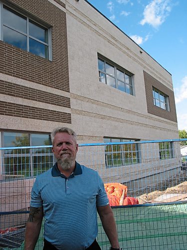 Canstar Community News Sept. 19, 2019 - La Salle School principal Robert Bouchard stands outside the new two-story addition to the school that houses six classrooms, two meeting room and a set of new bathrooms. (ANDREA GEARY/CANSTAR COMMUNITY NEWS)