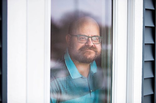 MIKAELA MACKENZIE / WINNIPEG FREE PRESS

Al Small, who has experience living in isolation as a person with a compromised immune system, poses for a portrait in his condo in Winnipeg on Tuesday, March 24, 2020. For Al Small story.
Winnipeg Free Press 2020