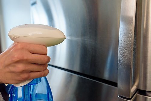 JESSE BOILY / WINNIPEG FREE PRESS
Kevin Shale sanitizes a fridge with his product Enozo that turns ordinary tap water into a sanitizer on Tuesday, March 24, 2020. Enozo is being sold around the world and has seen a large increase in sales in China, said Shale. 
Reporter: Martin Cash