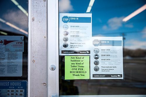 MIKAELA MACKENZIE / WINNIPEG FREE PRESS

Signs warning customers not to enter if they've been travelling or are symptomatic at Bigway Foods in Saint Jean Baptiste on Wednesday, March 25, 2020. For Danielle da Silva story.
Winnipeg Free Press 2020