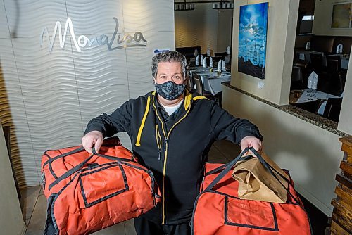 JESSE BOILY / WINNIPEG FREE PRESS
Joe Grande, owner of Mona Lisa restaurant, has now begun delivering pizzas for his business due to the slow down in business on Thursday, March 26, 2020.
Reporter: Doug Speirs