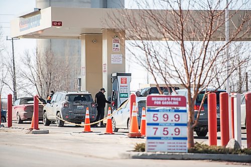 Mike Sudoma / Winnipeg Free Press
A customer fills up his vehicle at the Costco Gas Bar off of at the low price of 59.9 Thursday afternoon
March 26, 2020