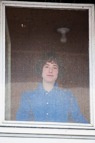 MIKAELA MACKENZIE / WINNIPEG FREE PRESS

Artist Natalie Baird poses in her window in Winnipeg on Thursday, March 26, 2020. 
Winnipeg Free Press 2020