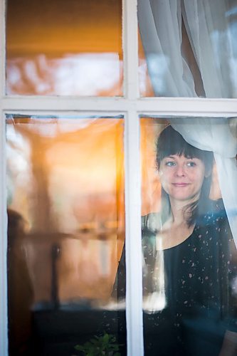 MIKAELA MACKENZIE / WINNIPEG FREE PRESS

Chantal DeGagne poses for a portrait in her window in Winnipeg on Friday, March 27, 2020. She have been self-isolated since March 8th, when her toddler was sick.
Winnipeg Free Press 2020