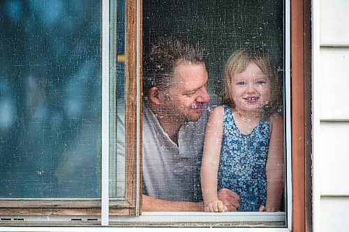 MIKAELA MACKENZIE / WINNIPEG FREE PRESS

Josey Krahn and Eloïse Krahn (2) pose for a portrait in their window in Winnipeg on Friday, March 27, 2020. They have been self-isolated since March 8th, when their toddler was sick.
Winnipeg Free Press 2020