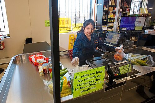 MIKE DEAL / WINNIPEG FREE PRESS
Radhi Chauhan, grocery store clerk at Dino's Grocery Mart, 84 Isabel St, is one of the frontline workers. 
200327 - Friday, March 27, 2020.