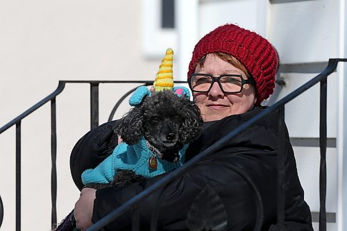 SHANNON VANRAES / WINNIPEG FREE PRESS
Barb Judt is the director of operations for the Animal Food Bank, a volunteer-based organization that provides pet food and other supplies to pet owners with little to no income. She was photographed at her Winnipeg home, with her dog Rocky, March 27, 2020.