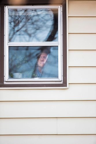 MIKAELA MACKENZIE / WINNIPEG FREE PRESS

Freelance illustrator, designer and cartoonist Jonathan Dyck poses for a portrait in his Wolseley apartment window in Winnipeg on Monday, March 30, 2020. 
Winnipeg Free Press 2020