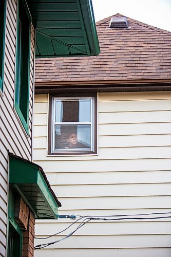 MIKAELA MACKENZIE / WINNIPEG FREE PRESS

Freelance illustrator, designer and cartoonist Jonathan Dyck poses for a portrait in his Wolseley apartment window in Winnipeg on Monday, March 30, 2020. 
Winnipeg Free Press 2020