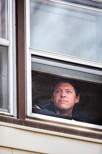 MIKAELA MACKENZIE / WINNIPEG FREE PRESS

Freelance illustrator, designer and cartoonist Jonathan Dyck poses for a portrait in his Wolseley apartment window in Winnipeg on Monday, March 30, 2020. 
Winnipeg Free Press 2020