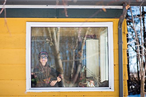 MIKAELA MACKENZIE / WINNIPEG FREE PRESS

Heidi Hunter, Winnipeg Beach based multidisciplinary artist, poses for a portrait in her studio window on Sunday, March 29, 2020. Hunter has been self-isolating since March 10th, and says that life right now is "breathing and drawing."
Winnipeg Free Press 2020