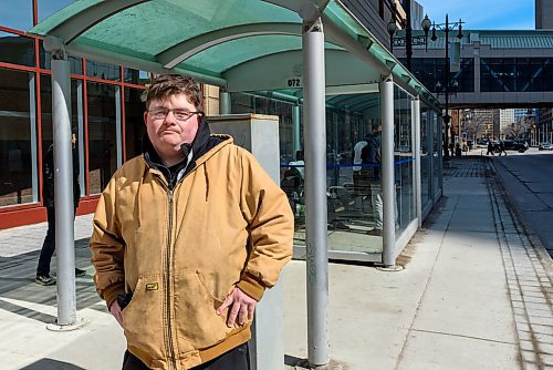 JESSE BOILY / WINNIPEG FREE PRESS
Jon Heilman, a transit rider, waits for the bus at a Portage Ave bus stop on Monday, March 30, 2020. Many riders are trying to keep their distance between each other as social distancing is practiced during the current pandemic. 
Reporter: Eva Wasney