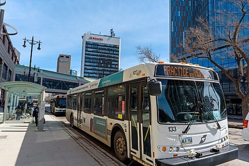 JESSE BOILY / WINNIPEG FREE PRESS
A transit bus shares a message for social distancing at a Portage Ave bus stop on Monday, March 30, 2020. Many riders are trying to keep their distance between each other as social distancing is practiced during the current pandemic. 
Reporter: Eva Wasney