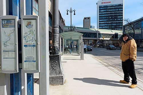 JESSE BOILY / WINNIPEG FREE PRESS
Jon Heilman, a transit rider, waits for the bus at a Portage Ave bus stop on Monday, March 30, 2020. Many riders are trying to keep their distance between each other as social distancing is practiced during the current pandemic. 
Reporter: Eva Wasney