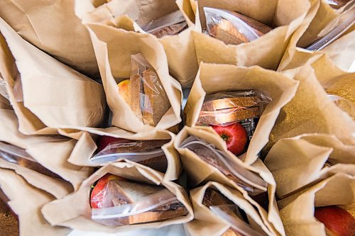 MIKAELA MACKENZIE / WINNIPEG FREE PRESS

Volunteers put together emergency kits with food, hygiene and baby products at Ma Mawi Wi Chi Itata in Winnipeg on Monday, March 30, 2020. For Eva Wasney story.
Winnipeg Free Press 2020