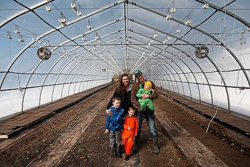 JOHN WOODS / WINNIPEG FREE PRESS
Jeff Veenstra and his partner Janna, owners of Wild Earth Farms, are photographed with their children in their vegetable greenhouse just north of Oakbank Monday, March 30, 2020. Veenstra, who mainly sells to restaurants, is part of a group of farmers who find it hard to do business during this COVID-19 pandemic.

Reporter: Lawrynuik