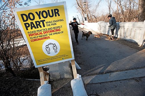 JOHN WOODS / WINNIPEG FREE PRESS
A sign reminding people of keeping their distance during this time of COVID-19 protocols is posted at the Assiniboine Park pedestrian bridge Monday, March 30, 2020. 

Reporter: ?