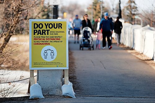 JOHN WOODS / WINNIPEG FREE PRESS
A sign reminding people of keeping their distance during this time of COVID-19 protocols is posted at the Assiniboine Park pedestrian bridge Monday, March 30, 2020. 

Reporter: ?