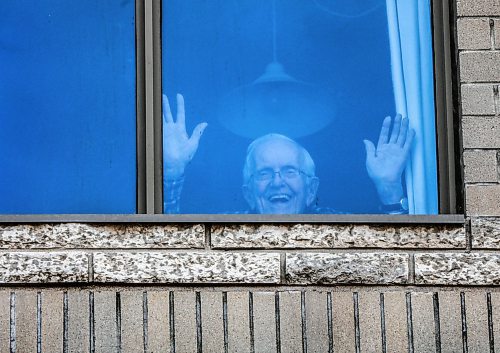 RUTH BONNEVILLE  /  WINNIPEG FREE PRESS 

Local - 101-year-old waving 

Photo of  care home resident, 101-year-old David Thompson,  waving from his 3rd story window at Misericordia Place on Tuesday.

Story on Misericordia calling for donations to help get ipads for residents wanting to visit their families.
101-year-old David Thompson  one of about 100 long-term residents isolated at the Winnipeg centre's personal care home, Misericordia Place.

See Doug Speirs story. 

March 31st,, 2020

