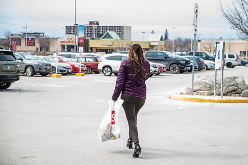 MIKAELA MACKENZIE / WINNIPEG FREE PRESS

A shopper walks out after going to a sale of hand sanitizer and N95 masks at Showcase at Polo Park mall in Winnipeg on Wednesday, April 1, 2020. For Eva Wasney story.
Winnipeg Free Press 2020