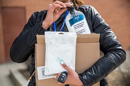 MIKAELA MACKENZIE / WINNIPEG FREE PRESS

Saranjit Dhaliwal, Misercordia staff, shows the hand sanitizer and N95 masks she bought at Showcase at Polo Park mall in Winnipeg on Wednesday, April 1, 2020. For Eva Wasney story.
Winnipeg Free Press 2020