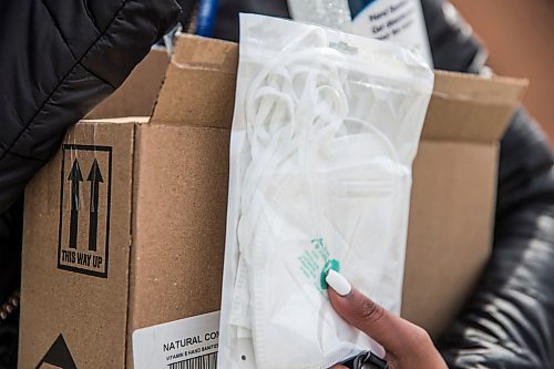 MIKAELA MACKENZIE / WINNIPEG FREE PRESS

Saranjit Dhaliwal, Misercordia staff, shows the hand sanitizer and N95 masks she bought at Showcase at Polo Park mall in Winnipeg on Wednesday, April 1, 2020. For Eva Wasney story.
Winnipeg Free Press 2020