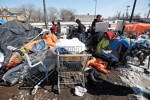 JOHN WOODS / WINNIPEG FREE PRESS
Kyle, right, helps clean up the camp with other members during COVID-19 in Winnipeg Sunday, April 5, 2020. 

Reporter: Taylor