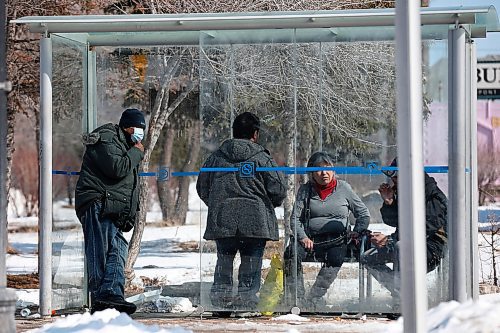 JOHN WOODS / WINNIPEG FREE PRESS
People wait in a bus shelter on Main Street at Higgins during COVID-19 in Winnipeg Sunday, April 5, 2020. 

Reporter: Taylor