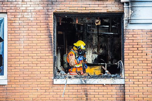 MIKAELA MACKENZIE / WINNIPEG FREE PRESS

A firefighter photographs the scene of an apartment fire on Sargent Avenue at Beverley Street in Winnipeg on Monday, April 6, 2020. For Maggie story.
Winnipeg Free Press 2020