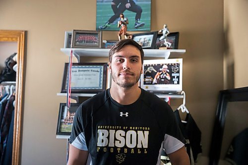 MIKAELA MACKENZIE / WINNIPEG FREE PRESS

Bisons player Derek Dufault, who is ready for his CFL career to start in Hamilton but will have to wait because of the pandemic, poses for a portrait at his home in Winnipeg on Monday, April 6, 2020. 
Winnipeg Free Press 2020