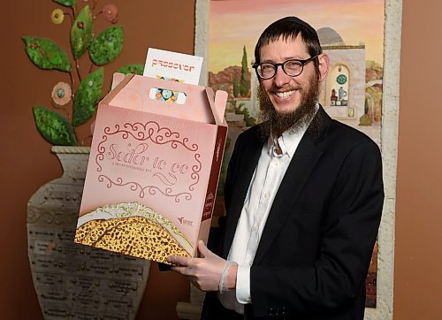 JESSE BOILY  / WINNIPEG FREE PRESS
Rabbi Boruch Heidingsfeld poses with the seder kits at Chabud- Lubavitch of Winnipeg on Monday. Monday, April 6, 2020. Due to the COVID-19 pandemic passover is being adapted so many are using the seder kits for at home meals this year.
Reporter: Brenda Suderman