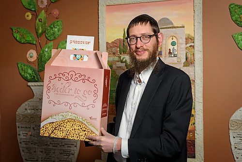 JESSE BOILY  / WINNIPEG FREE PRESS
Rabbi Boruch Heidingsfeld poses with the seder kits at Chabud- Lubavitch of Winnipeg on Monday. Monday, April 6, 2020. Due to the COVID-19 pandemic passover is being adapted so many are using the seder kits for at home meals this year.
Reporter: Brenda Suderman